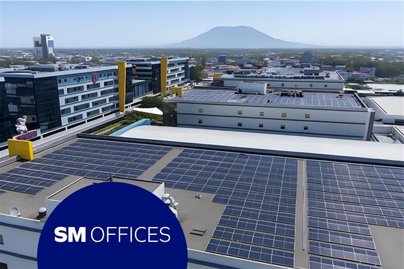 SM Offices building with rooftop solar panels showcasing renewable energy use.